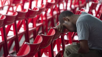 A family member of a passenger on the Trigana Air plane which crashed waits for news at the crisis centre at Sentani Airport in Jayapura, Papua, Indonesia. Andika Wahyu / Antara Foto / Reuters