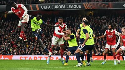 Arsenal attacker Eddie Nketiah heads at goal. AFP