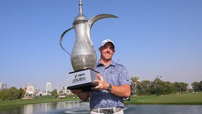 Rory McIlroy with the Dallah trophy after winning the Dubai Desert Classic, beating Patrick Reed by one shot thanks to a birdie on the final hole. Getty