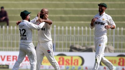 Pakistan's Sajid Khan, centre, celebrates with teammates after dismissing England's Rehan Ahmed. EPA