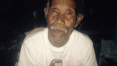 Funchu Tamang, 101, sits on a bed in a hospital in Nuwakot district on May 3, 2015, after being rescued from his collapsed home a day earlier. AFP