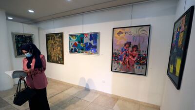 A visitor consults the exhibition's catalogue.