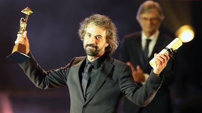 Uruguayan director Alvaro Brechner holds the golden pyramid award for Best Director. Photo / EPA