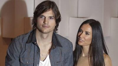 The actor (and model) Ashton Kutcher, left, with his wife, the actress Demi Moore, at the Colcci fall-winter 2011 collection at Sao Paulo Fashion Week, in Sao Paulo, Brazil.