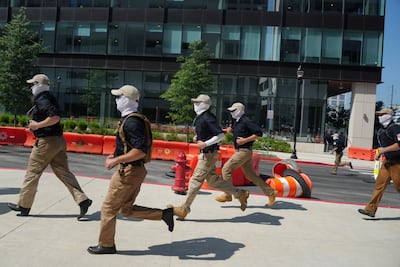 Members of the Patriot Front group run near a metro station, on the 250th anniversary of U. S. independence, in New Carrollton, Maryland, U. S. , July 4, 2026. REUTERS / Nathan Howard