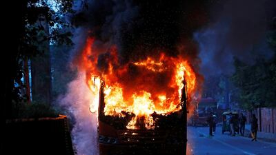 A passenger bus burns after it was set on fire by demonstrators during a protest against a new citizenship law, in New Delhi, India, December 15, 2019. REUTERS/Adnan Abidi TPX IMAGES OF THE DAY