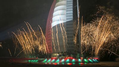 Burj al Arab, one of the iconic Dubai buildings, lights up in the light of fireworks and a light show. Silvia Razgova / The National