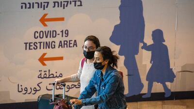 Travellers arrive at Ben Gurion airport near Tel Aviv. AP