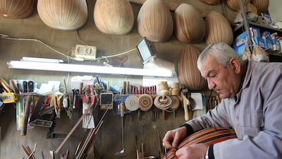 Lebanese oud maker and player Nazih Ghadban works on an oud body at his workshop in Ras Baalbek, Lebanon. Reuters