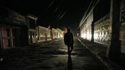 A man walks by a street in Illapel, Chile after a magnitude 8.3 earthquake. Luis Hidalgo / AP Photo