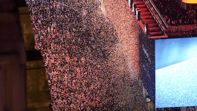 Confetti drops on people at Times Square, during New Year’s Eve celebrations in New York City. Reuters