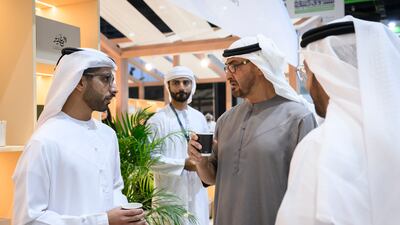 President Sheikh Mohamed speaks with exhibitor Rashed Al Mansoori at Adihex. Abdulla Al Neyadi / UAE Presidential Court