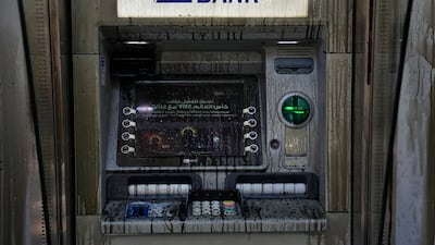 Angry depositors also poured diesel on a Blom Bank ATM. AP