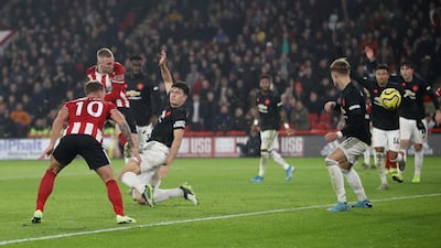 Sheffield United's Oliver McBurnie scores their third goal. Reuters