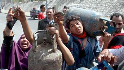Hosni Mubarak tried to make hidden cuts, such as reducing the weight of gas cylinders and the quality of bread. Khaled Elfiqi / EPA