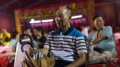 A guest watches a Chiu Chow opera performance. EPA