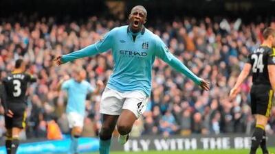 Manchester City's Ivorian midfielder Yaya Toure celebrates scoring the opening goal for Manchester City. 'Yaya can p lay in every position' says his manager, Roberto Mancini.