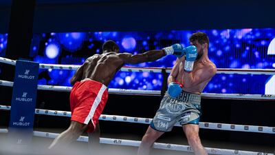 Rocky Fielding, right, defends against Emmanuel Danso.