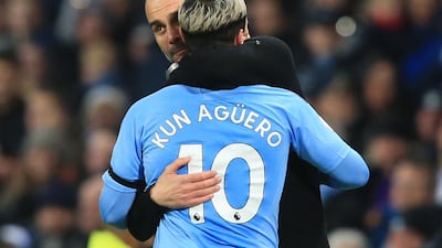 Pep Guardiola embraces striker Sergio Aguero. AFP