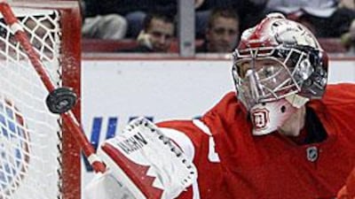 The Red Wings goalie Jimmy Howard deflects a shot during 2-0 loss to the Atlanta Thrashers.