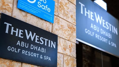 A "Go Safe" sign is seen at the entrance of the hotel