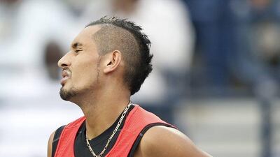 epa05182073 Nick Kyrgios of Australia reacts to pain in the back during his semi final match against Stanislas Wawrinka of Switzerland at Dubai Duty Free Tennis ATP Championships in Dubai, United Arab Emirates, 26 February 2016. EPA/ALI HAIDER