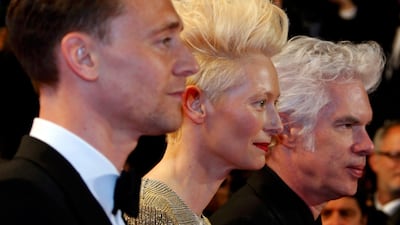 From left: Cast members Tom Hiddleston, Tilda Swinton and director Jim Jarmusch pose on the red carpet as they arrive for the screening of the film "Only Lovers Left Alive". Eric Gaillard / Reuters