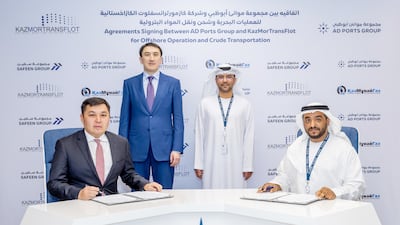 Capt Mohamed Al Shamisi, managing director and group chief executive of AD Ports Group, and Mirzagaliyev Magzum, chairman of KazMunayGas, witness the signing of the agreement. Photo: AD Ports Group