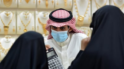 Saudis shop at a jewellery shop in the Tiba gold market in the capital Riyadh. AFP