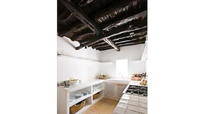 The couple knocked out walls to bring in more light and enhanced the home's natural features.