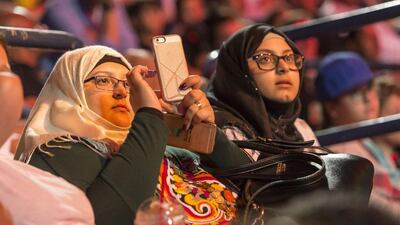 Fans get reading for the first of two shows at the Dubai Duty Free Tennis Stadium for the WWE Live Dune Bash wrestling event. Antonie Robertson/The National