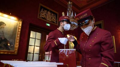 Staff prepare bags of Sachertorte chocolate cakes for delivery as Valentine's Day gifts, at the Hotel Sacher in Vienna, Austria. EPA