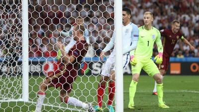 Denis Glushakov (L) of Russia shown as the equaliser is scored during the Uefa Euro 2016 group B preliminary round match between England and Russia at Stade Velodrome in Marseille, France, 11 June 2016. Tolga Bozoglu / EPA