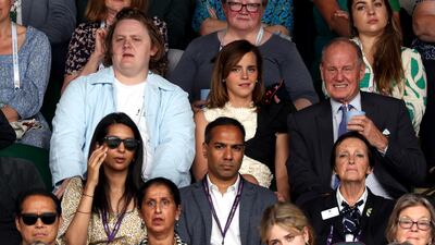 Actress Emma Watson, centre, attends the Wimbledon women's singles final on Saturday. PA
