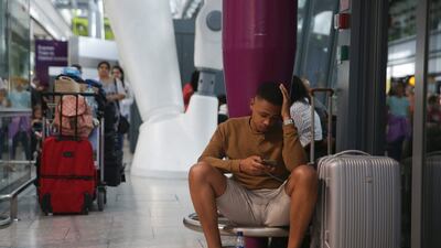 Travellers at Heathrow Airport Terminal 5 after massive IT systems failure caused British Airways to cancel all flights from Heathrow and Gatwick airports on Saturday, May 27, 2017, the start of a holiday weekend in Britain. Daniel Leal-Olivas / AFP