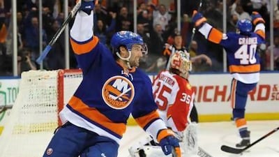Colin McDonald, left, and the New York Islanders are enjoying a late-season surge. Kathy Kmonicek / AP Photo