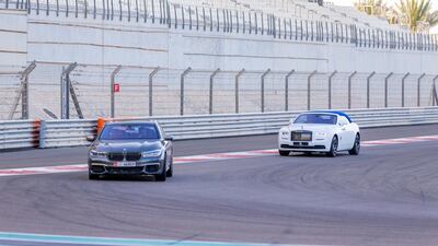 One of the pace cars takes the lead pack into the first corner. Courtesy Abu Dhabi Motors