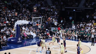 Devin Booker of the USA scores against Australia.