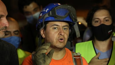 Francisco Lermanda, a member of the Chilean team, after digging through the rubble of buildings which collapsed. Reuters