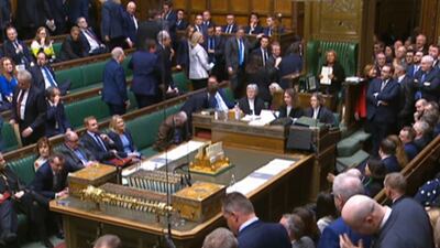 SNP and Conservative MPs walk out of the Commons chamber in the House of Commons in London. PA Wire