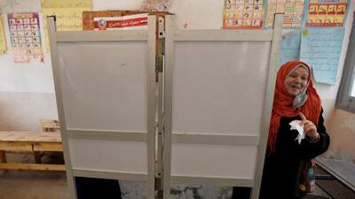 An Egyptian woman votes during the first day of the presidential election.