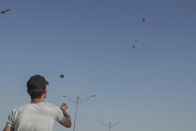 A man flies his kite along with others above the Iraqi city of Karbala. Haider Husseini / The National