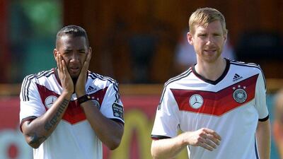 Germany defenders Jerome Boateng, left, and Per Mertesacker, right, will be tasked with stopping Cristiano Ronaldo when Germany and Portugal meet on Monday in their 2014 World Cup Group G opener. Thomas Eisenhuth / EPA / June 12, 2014