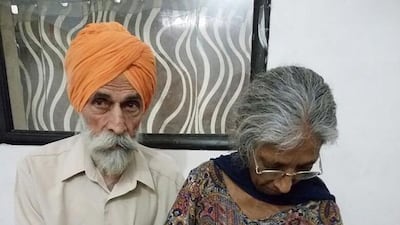Daljinder Kaur, 70, holds her newborn baby with her 79-year-old husband Mohinder Singh Gill, at The National Fertility Centre in Hisar, Haryana. Photo: National Fertility Centre / AFP Photo