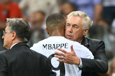 Real Madrid coach Carlo Ancelotti gives Kylian Mbappe a hug at the final whistle. AFP