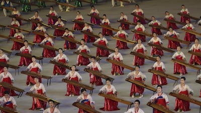 Performers wearing traditional dress. Getty Images