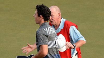 Dave Renwick, right, the caddie of Ricardo Gonzalez, informs Rory McIlroy of a possible rules violation after the latter completed his third round at the Abu Dhabi HSBC Golf Championship. Ross Kinnaird / Getty Images