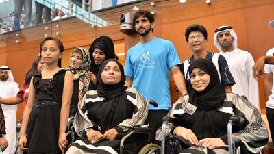 Sheikh Hamdan bin Mohammed with some spectators at the Nad Al Sheba Sports Complex in Dubai. (Wam / April 15, 2014)