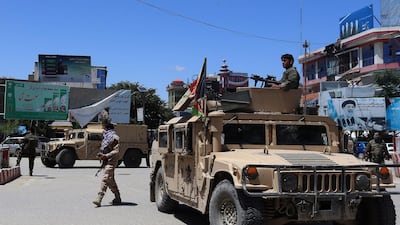 Afghan security forces sit in a Humvee vehicle amid ongoing fighting between Taliban militants and Afghan security forces in Kunduz on May 19, 2020. AFP