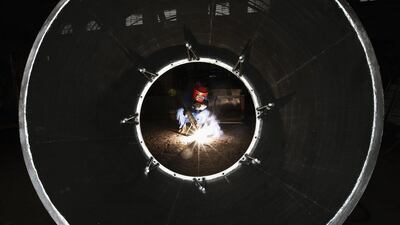 An employee works at a machine manufacturing factory in Huaibei, Anhui province. Growth in China’s vast factory sector slackened in August as foreign and domestic demand slowed, stoking speculation that further policy easing would be needed to prevent the economy from stumbling once more. Reuters
